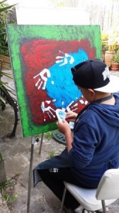 Peter, a member of the Koorie Youth Group working on his fantastic piece of art for the Monash Medical Centre Column Art Project